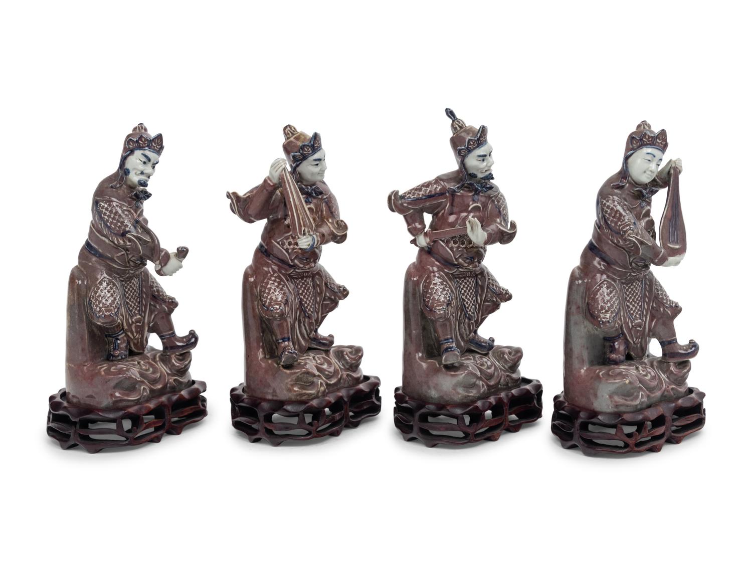 A Set of Four Chinese Underglaze Blue and Red Porcelain Figures of Guardians