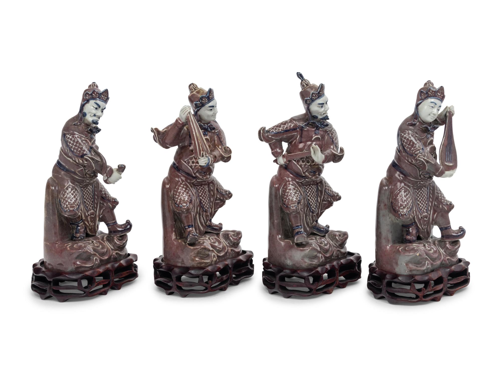 A Set of Four Chinese Underglaze Blue and Red Porcelain Figures of Guardians