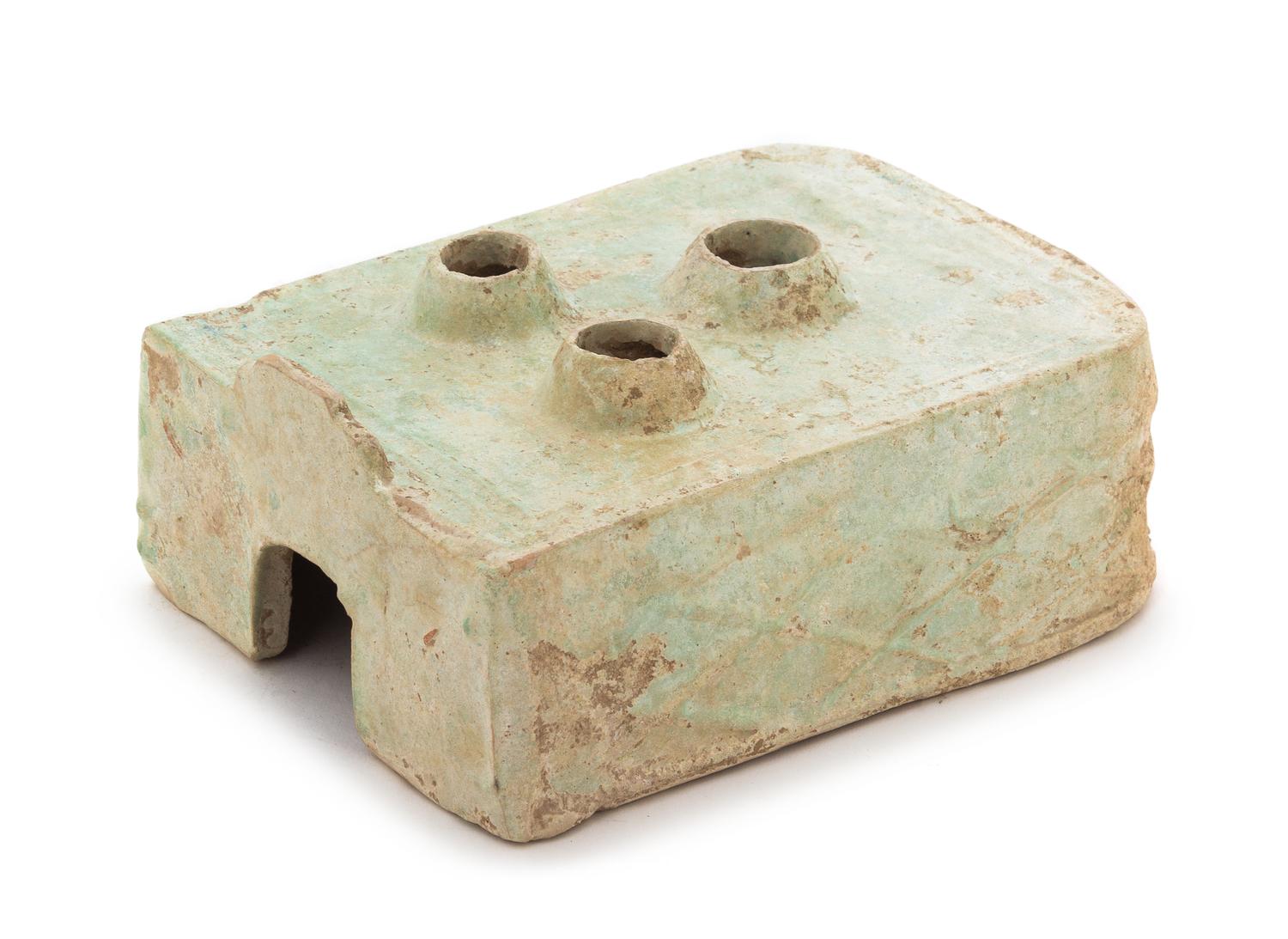 A Chinese Green Glazed Pottery Model of a Stove Length 8 3/4 x width 6 1/2 x height 3 inches. — HAN DYNASTY (206 B.C. - A.D. 220)