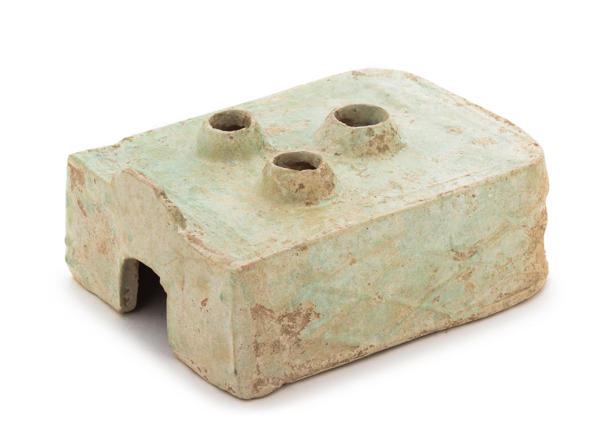 A Chinese Green Glazed Pottery Model of a Stove Length 8 3/4 x width 6 1/2 x height 3 inches. — HAN DYNASTY (206 B.C. - A.D. 220)