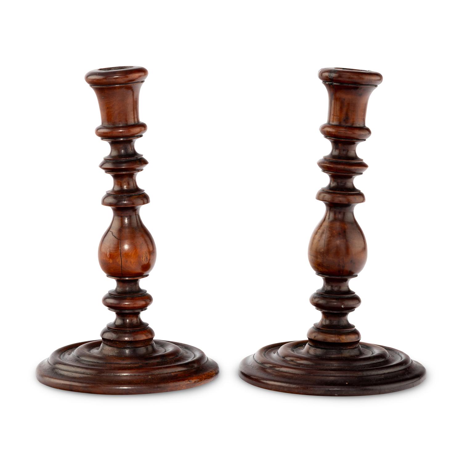 A Pair of English Yew Wood Candlesticks