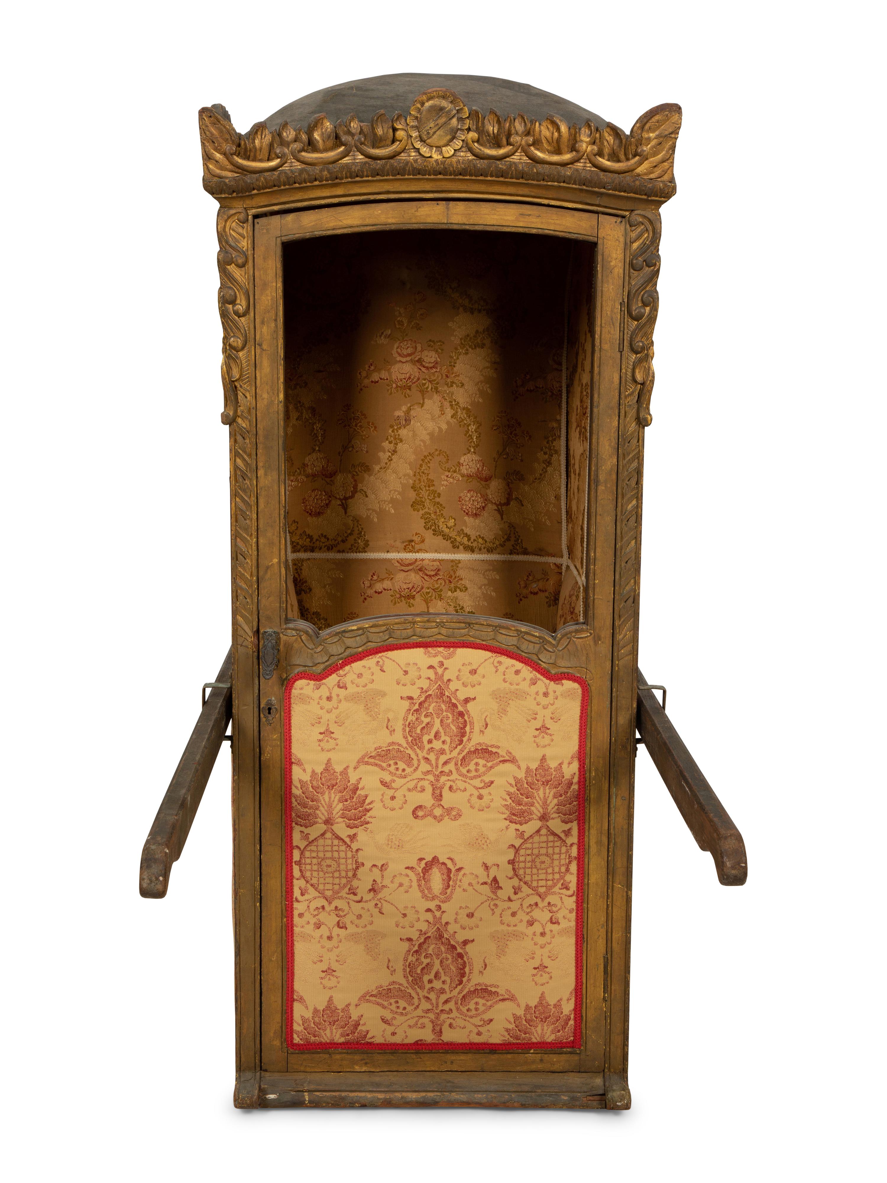 A Venetian Carved and Painted Giltwood Sedan Chair