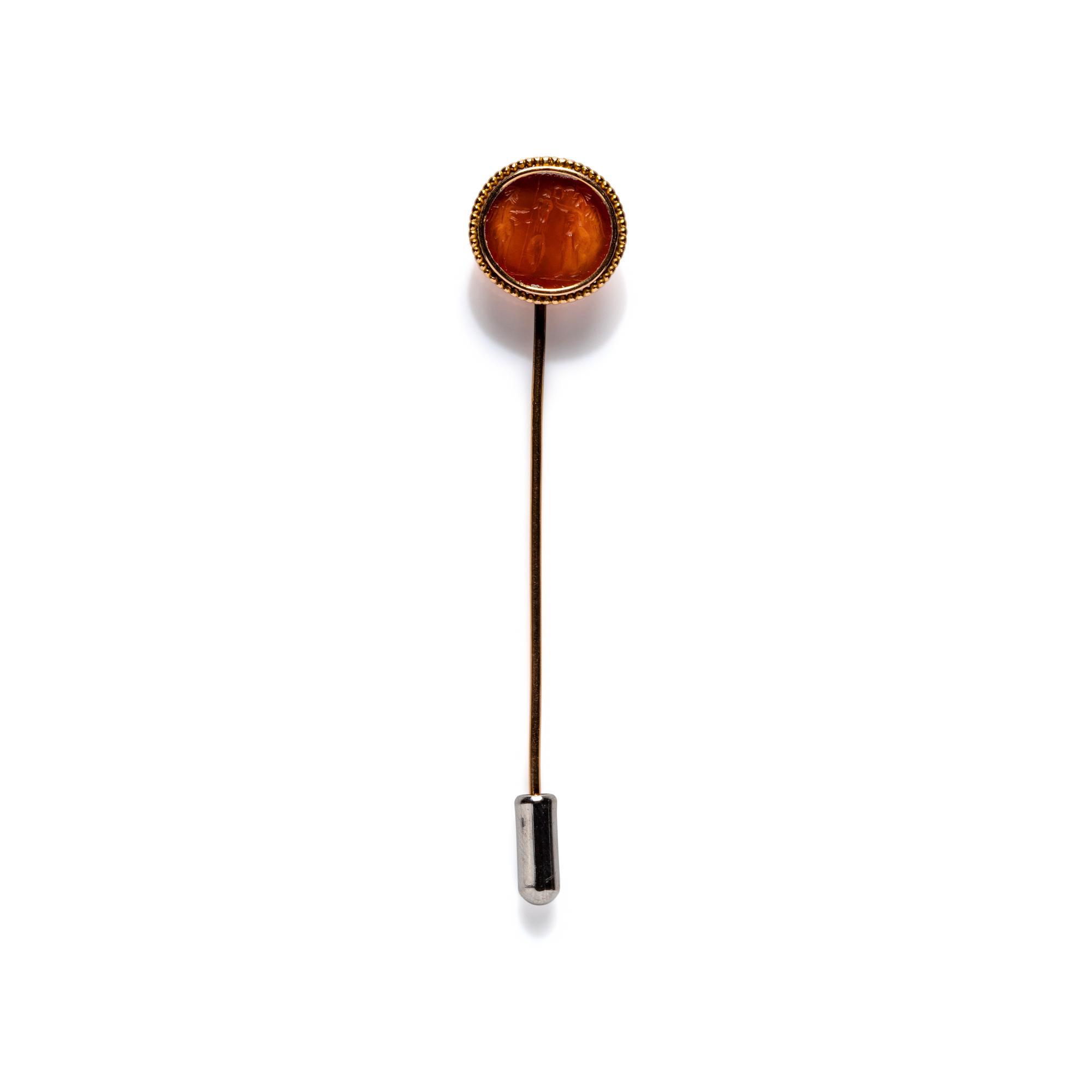 A Roman Carnelian Intaglio with Two Erotes Flanking a Tropaion — Set in a 19th century gold pin