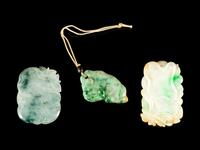 Three Chinese Carved Jadeite Pendants