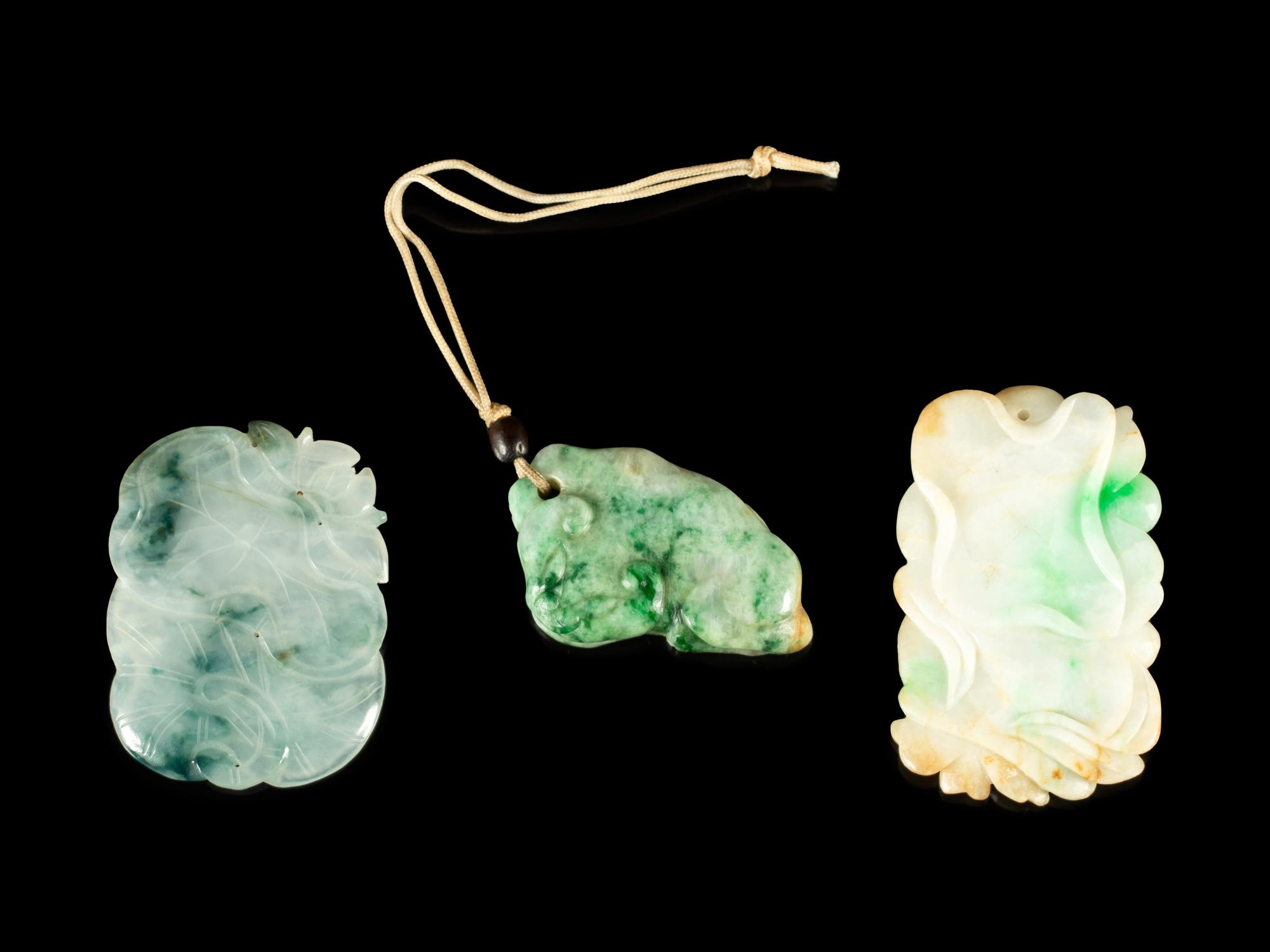 Three Chinese Carved Jadeite Pendants