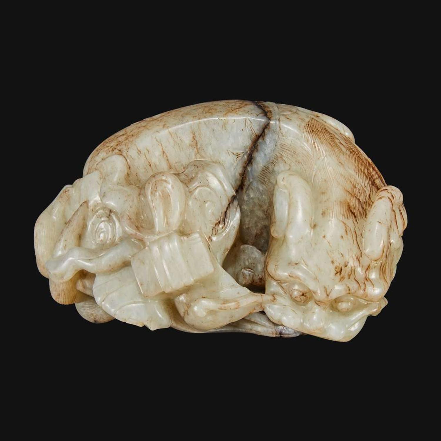 A Chinese carved jade figure of recumbent qilin