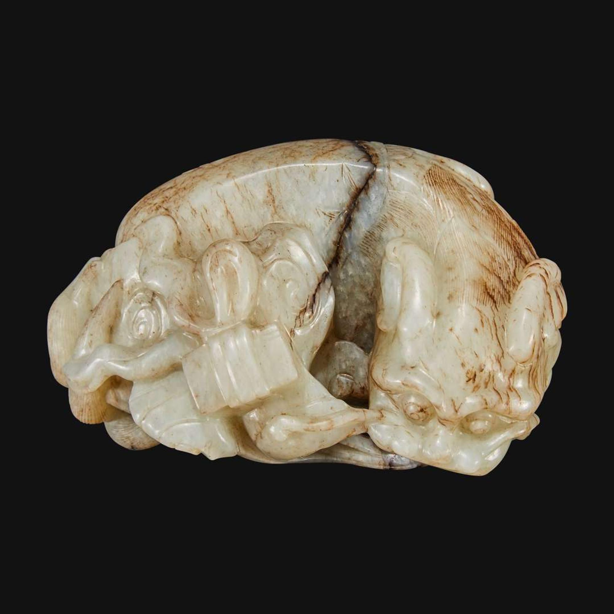 A Chinese carved jade figure of recumbent qilin