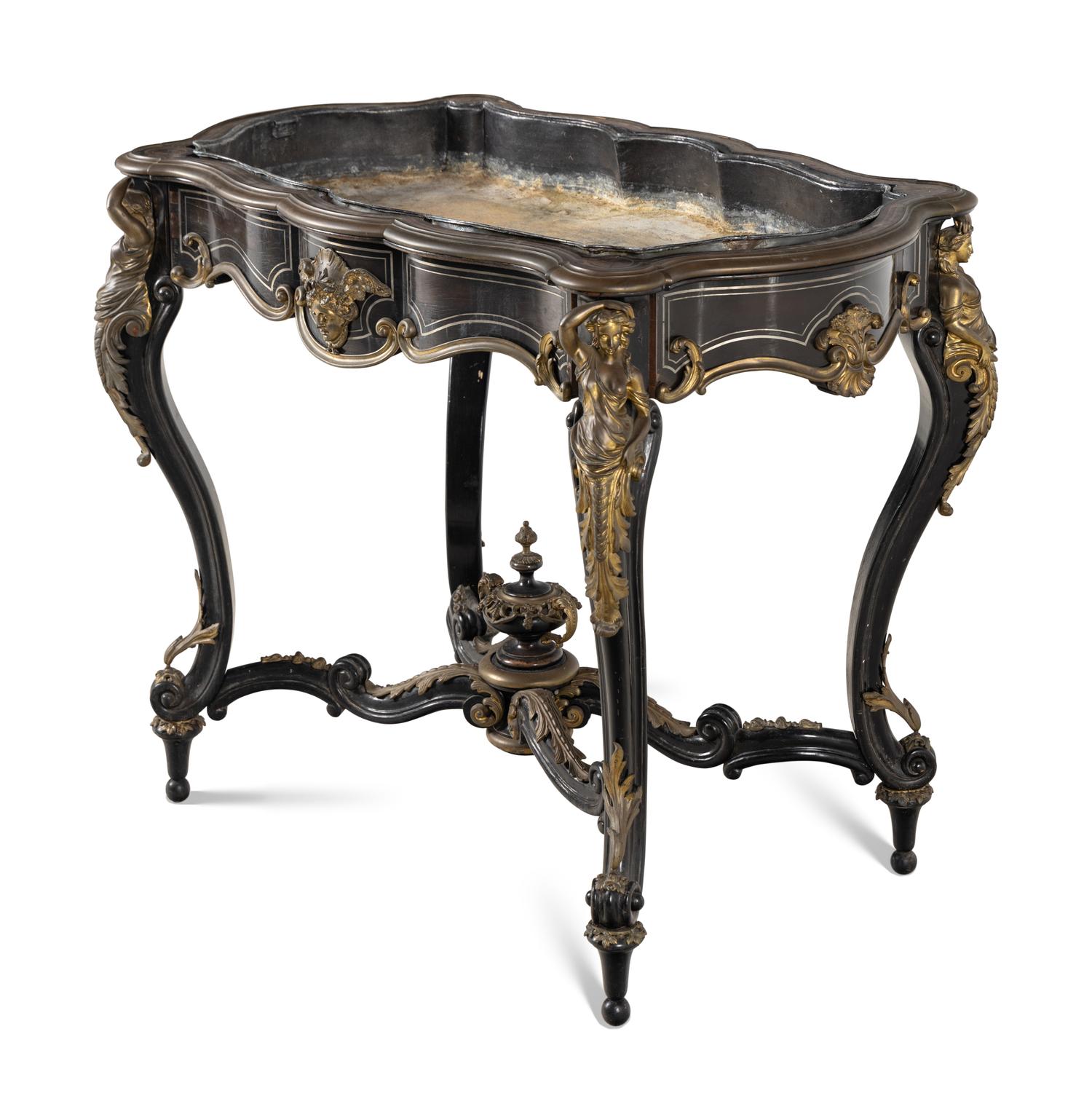 A Napoleon III Gilt Bronze Mounted Ebonized Jardinière Table