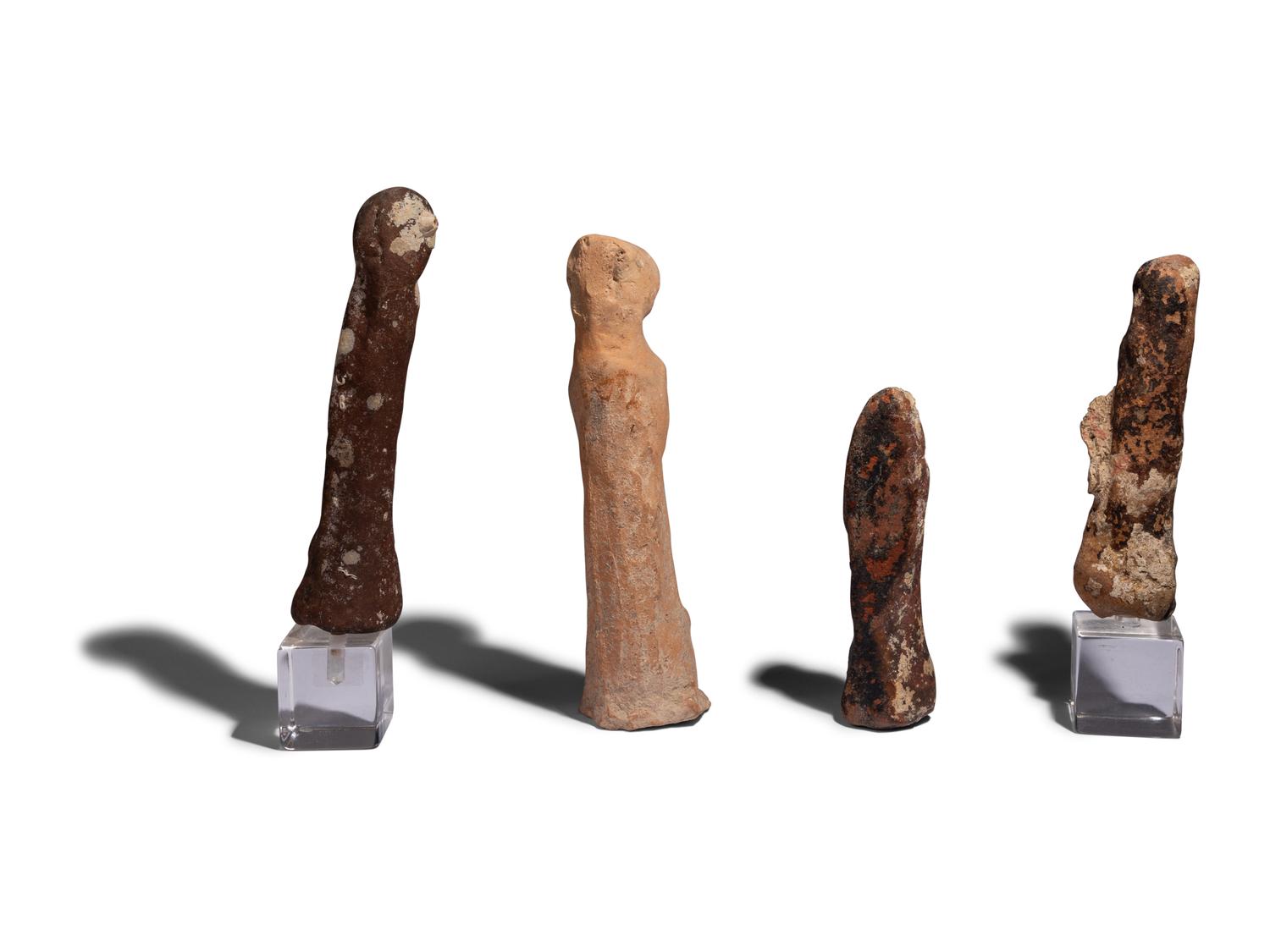 Four Near Eastern Stone and Terracotta Figures of Tanit