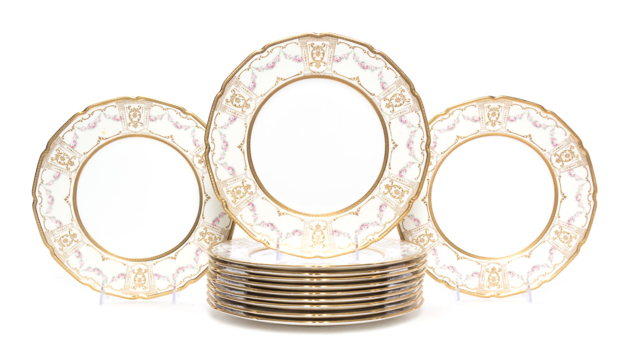 A Set of Twelve Royal Doulton Porcelain Dinner Plates Diameter 10 1/2 inches.