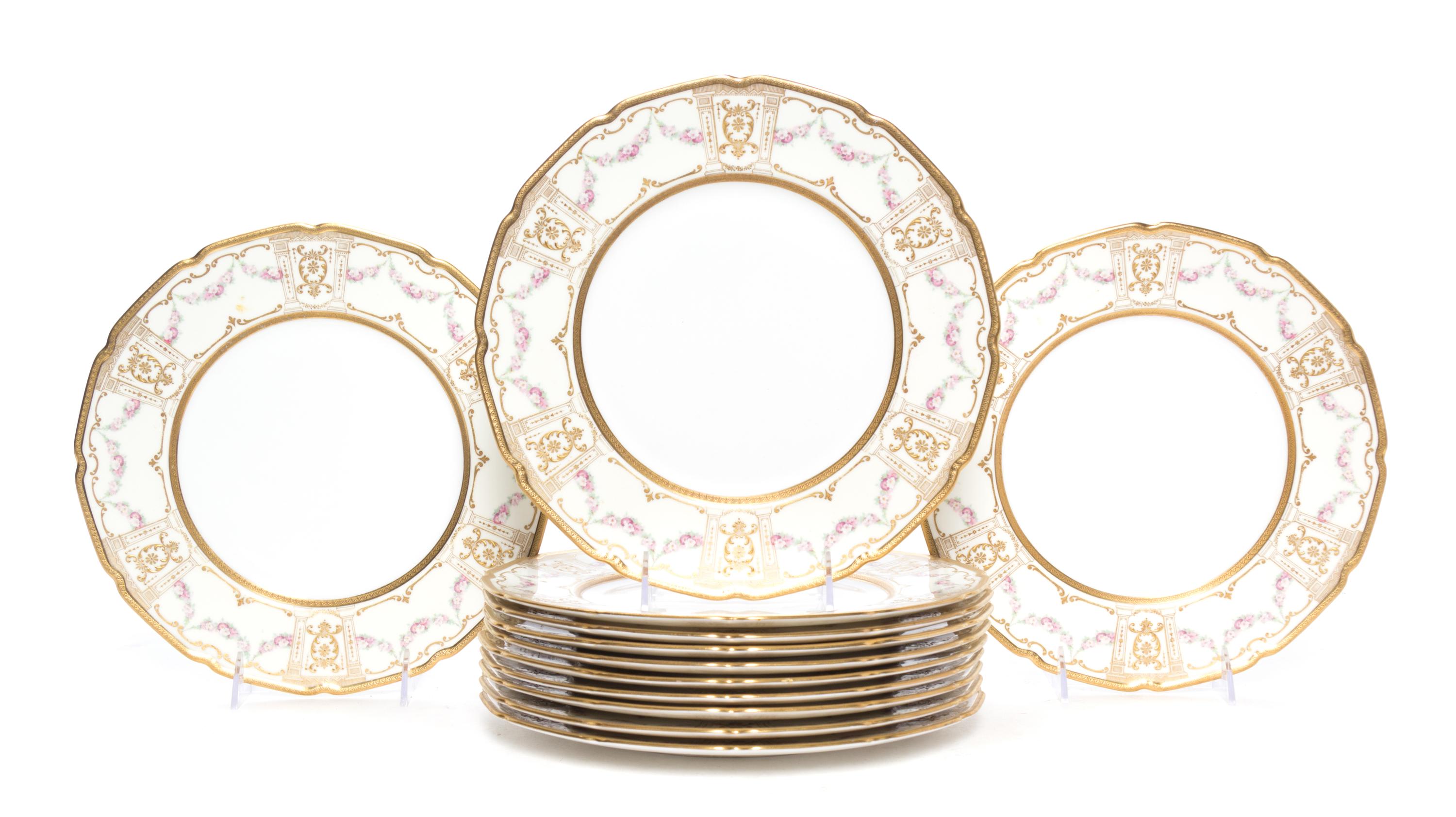 A Set of Twelve Royal Doulton Porcelain Dinner Plates Diameter 10 1/2 inches.