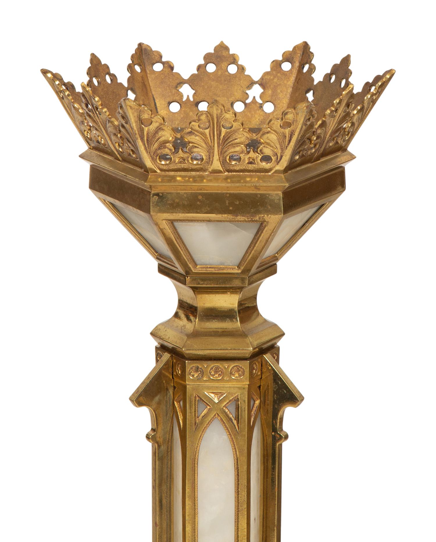 A Pair of Gothic Style Brass and Inset Glass Candlesticks