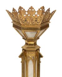 A Pair of Gothic Style Brass and Inset Glass Candlesticks