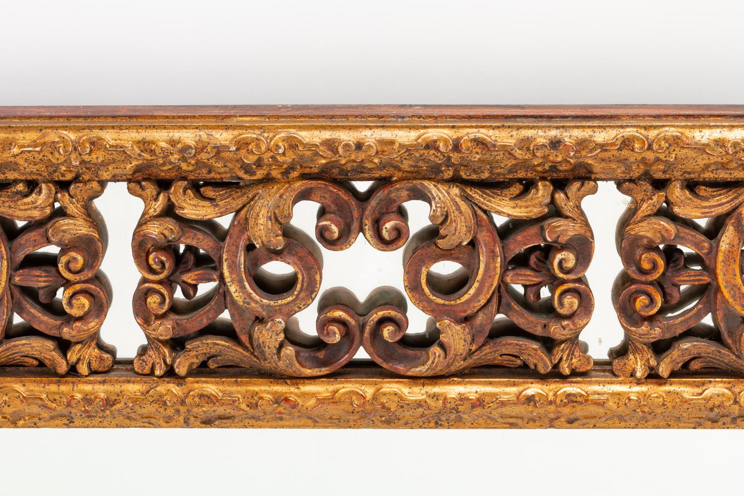 A Spanish Baroque Style Giltwood Mirror