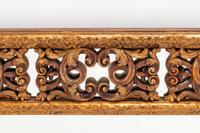 A Spanish Baroque Style Giltwood Mirror