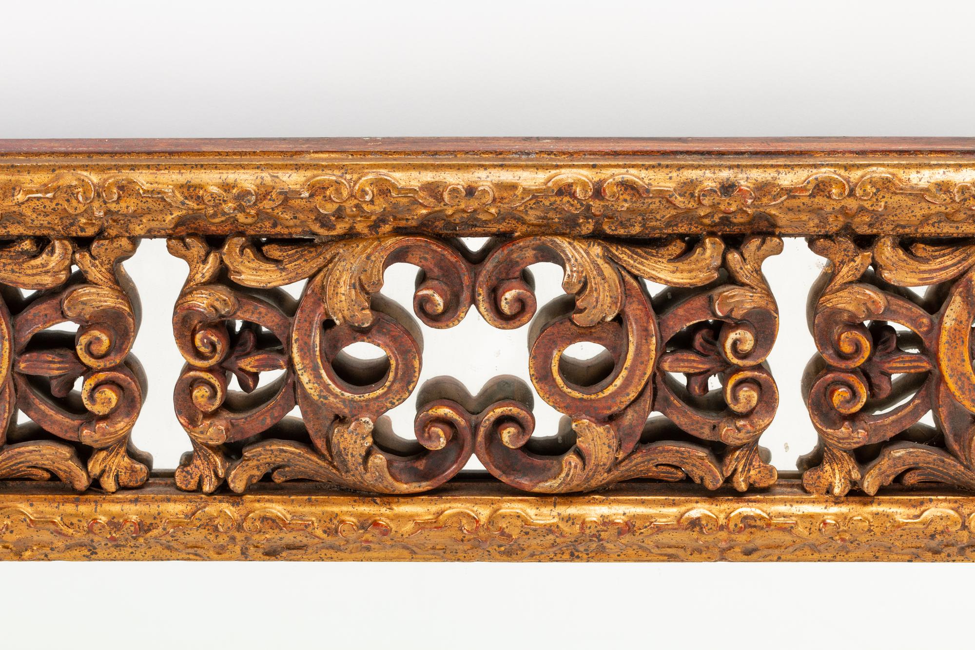 A Spanish Baroque Style Giltwood Mirror