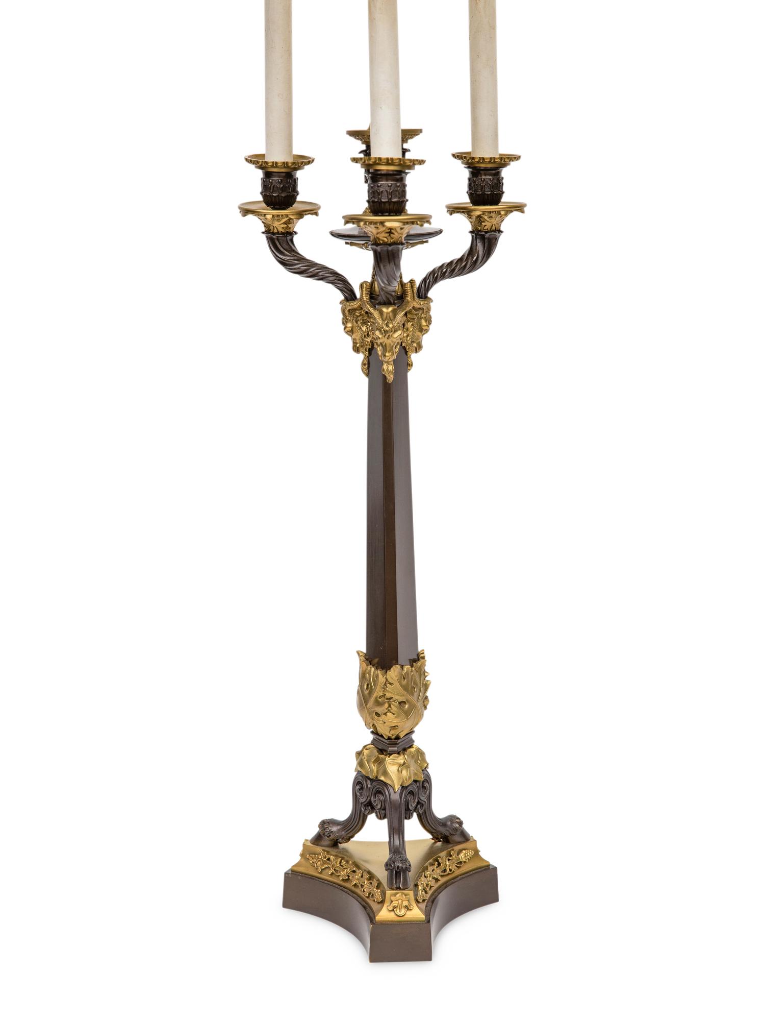 A Pair of Louis Philippe Style Gilt and Patinated Bronze Four-Light Candelabra