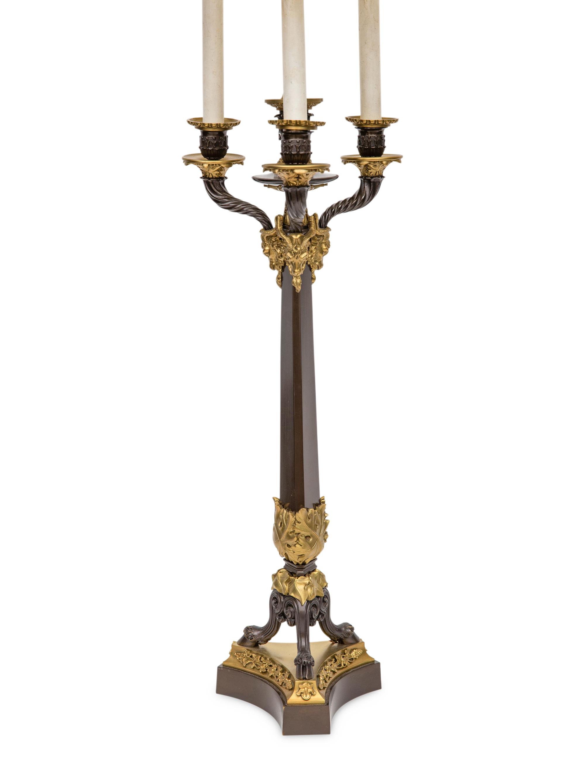 A Pair of Louis Philippe Style Gilt and Patinated Bronze Four-Light Candelabra