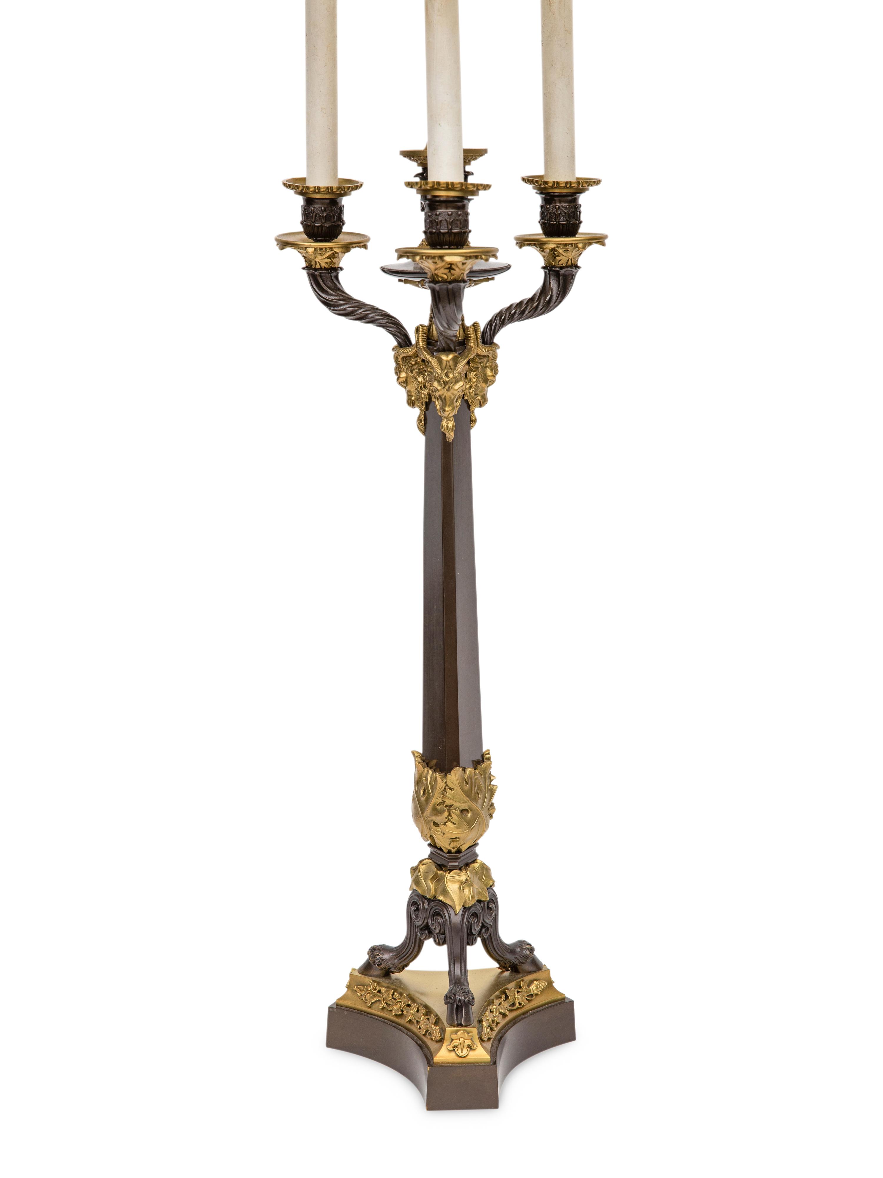 A Pair of Louis Philippe Style Gilt and Patinated Bronze Four-Light Candelabra