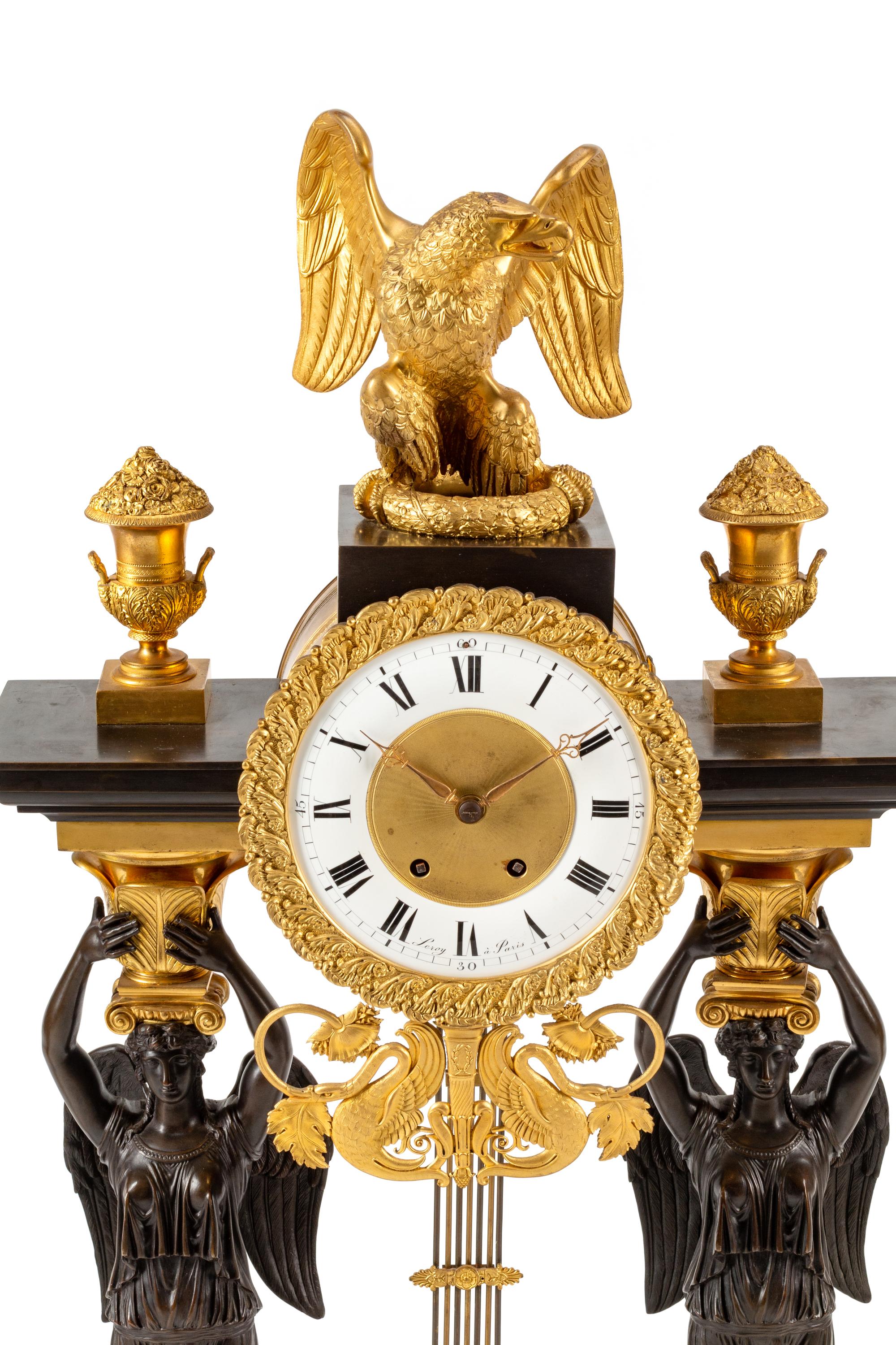 A Large Empire Style Gilt and Patinated Bronze Clock Garniture