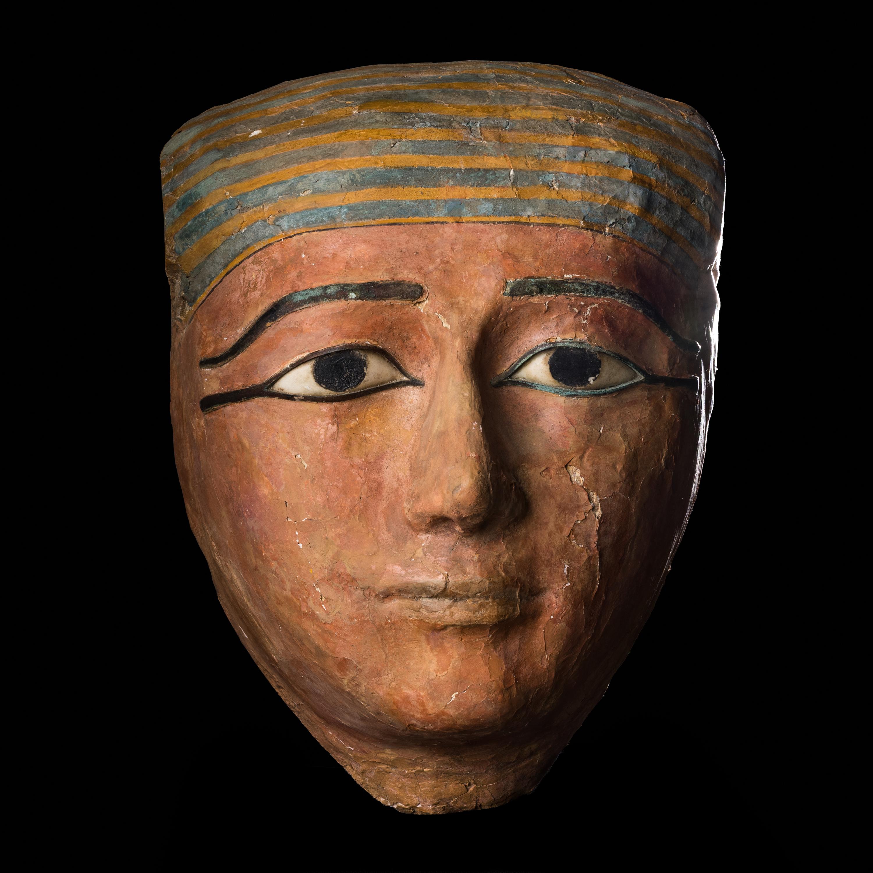 An Egyptian Polychrome Wood Mummy Mask with Bronze Inlays | Freeman's