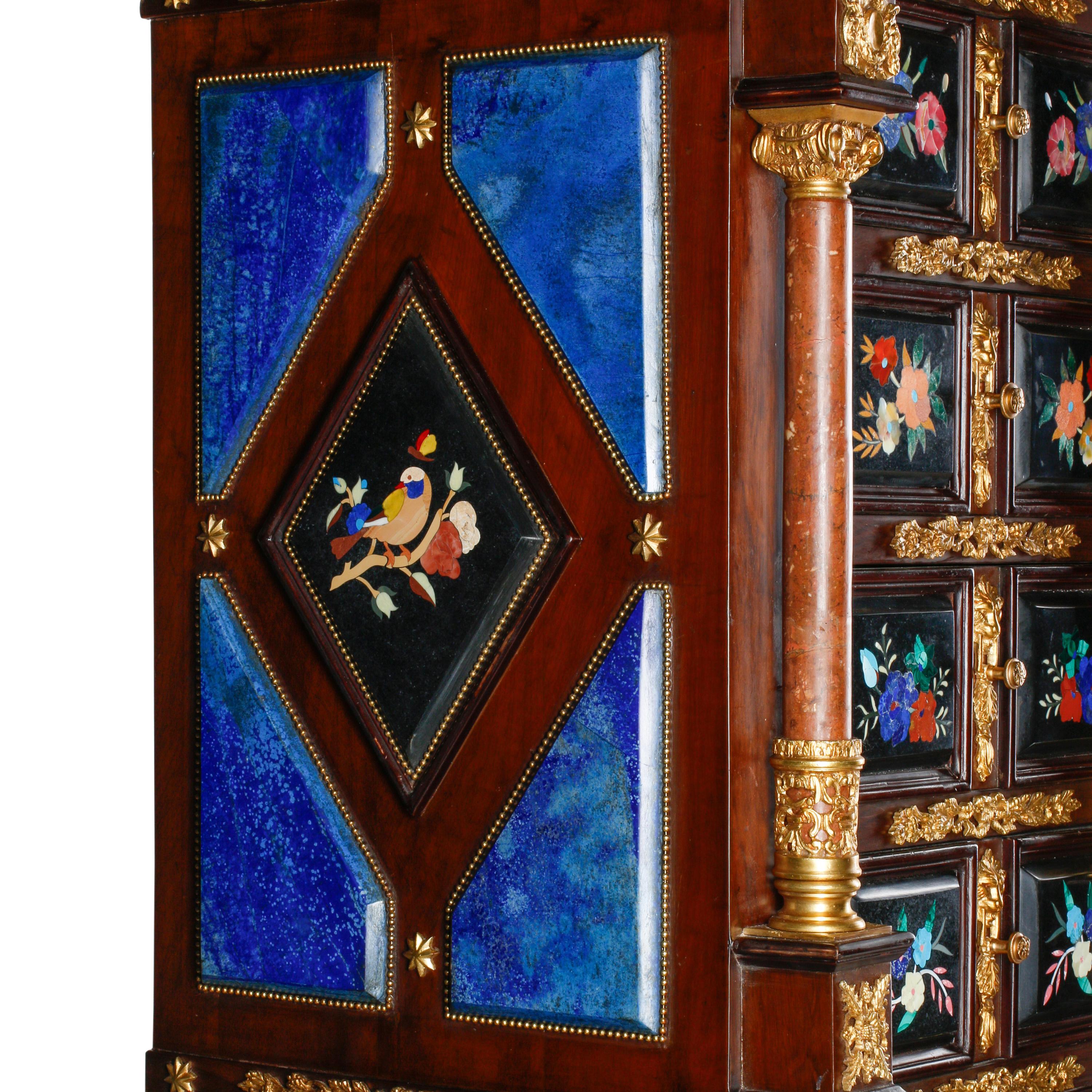 An Italian Baroque Style Gilt Bronze Mounted Pietra Dura, Lapis Lazuli and Giltwood Cabinet on Stand