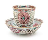 A Chinese Export Famille Rose Reticulated Porcelain Teacup and Saucer
