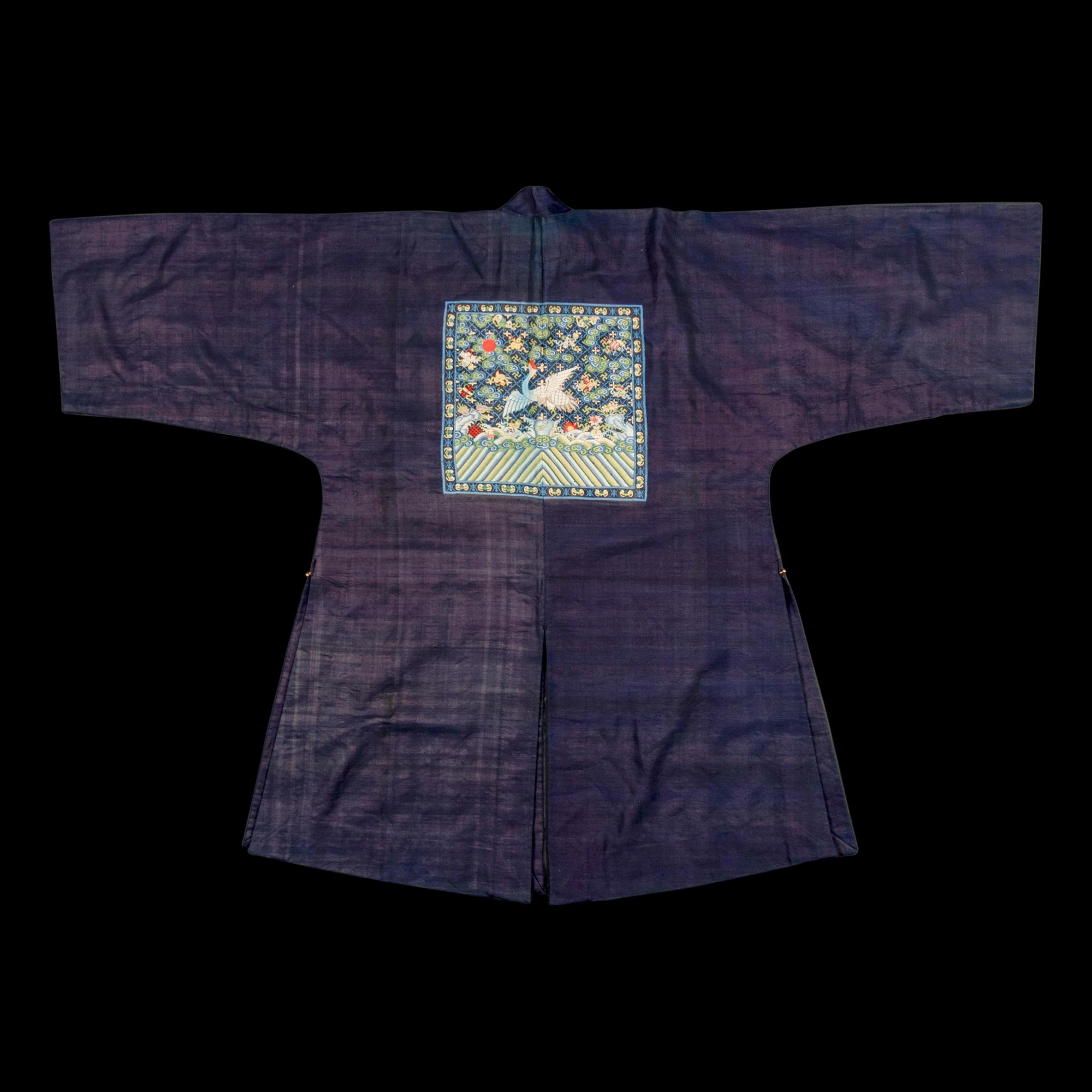 A Chinese Navy Blue Ground Official's Surcoat, Bufu, and A Velvet-Brimmed Winter Hat, Jiguan, 19th Century 清中晚期 藍地一品文官補服及冬吉冠一頂