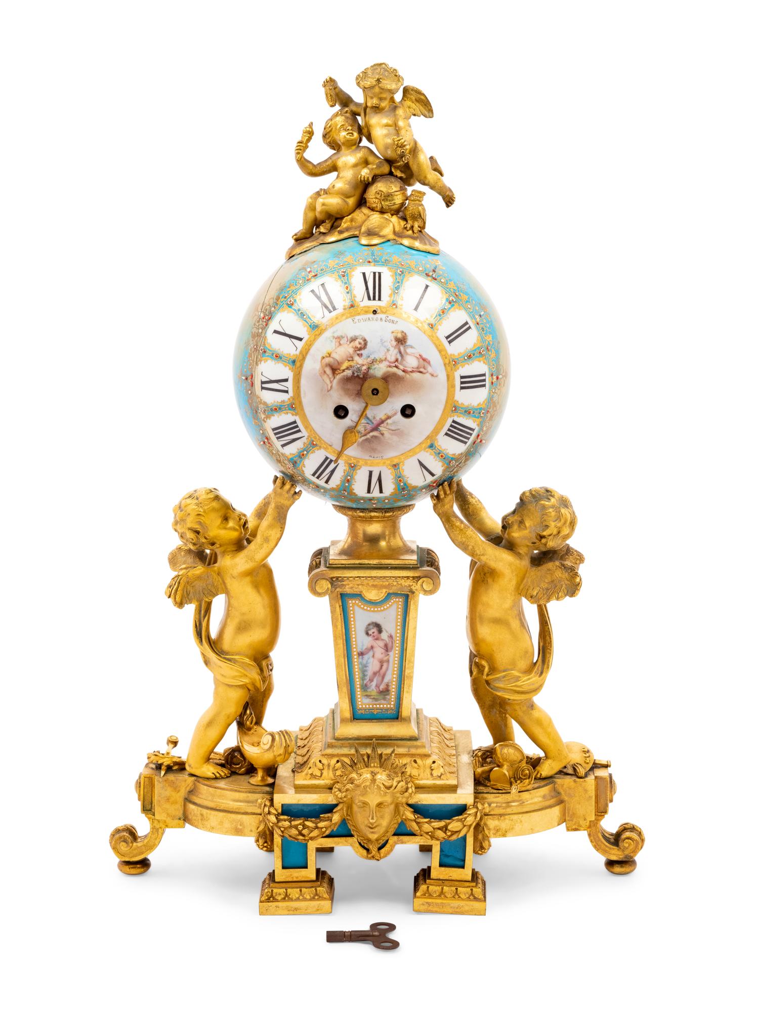 A Sèvres Style Porcelain and Gilt Bronze Mounted Three-Piece Clock Garniture
