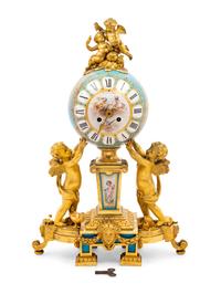 A Sèvres Style Porcelain and Gilt Bronze Mounted Three-Piece Clock Garniture