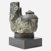 An Indian carved black stone head of a female Gahadavala Dynasty, 12th Century