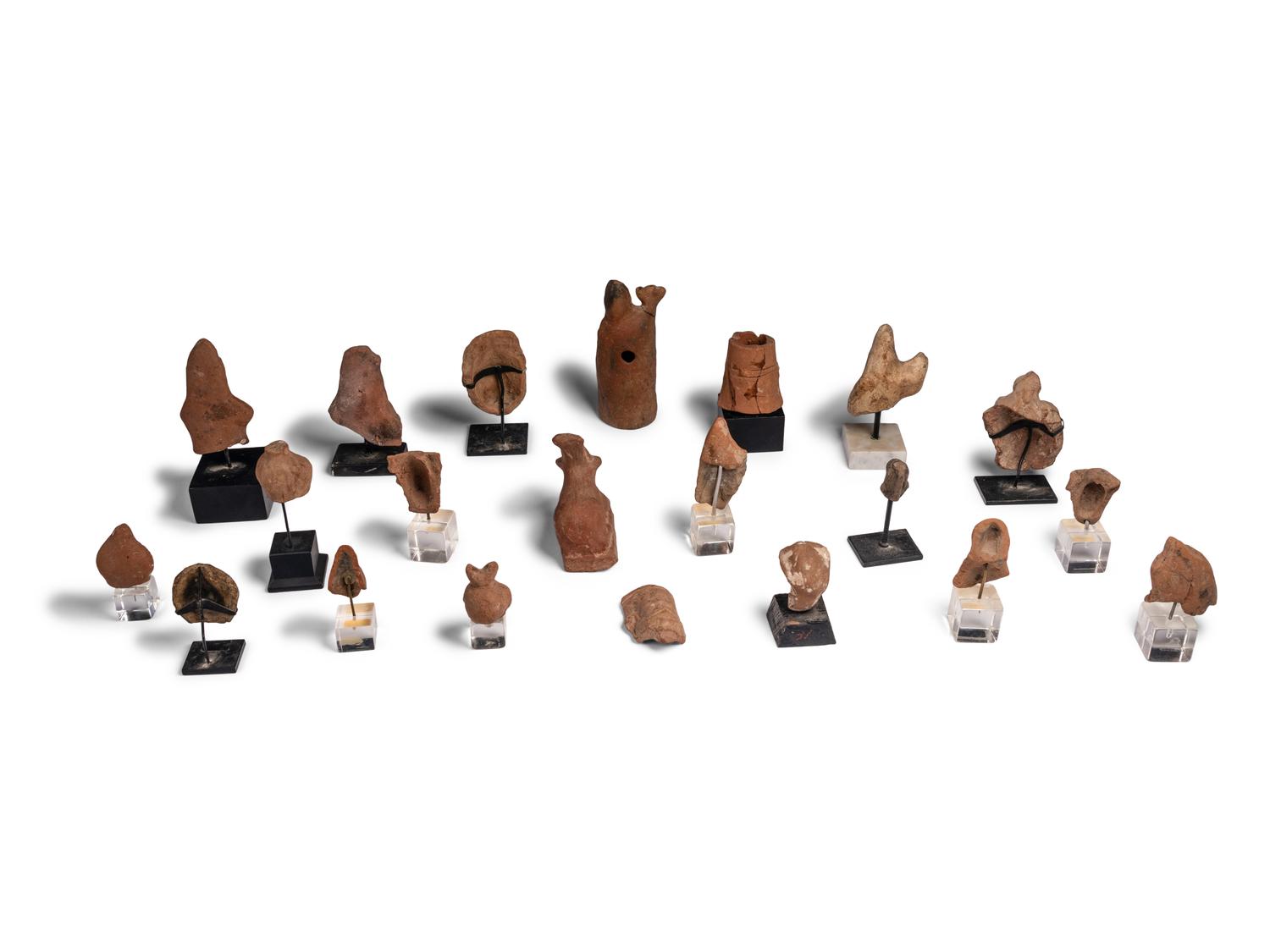 Twenty-One Egyptian Terracotta Heads and Figures