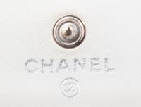 A Chanel White Dot Flap Handbag, 7.5" x 5" x 1".