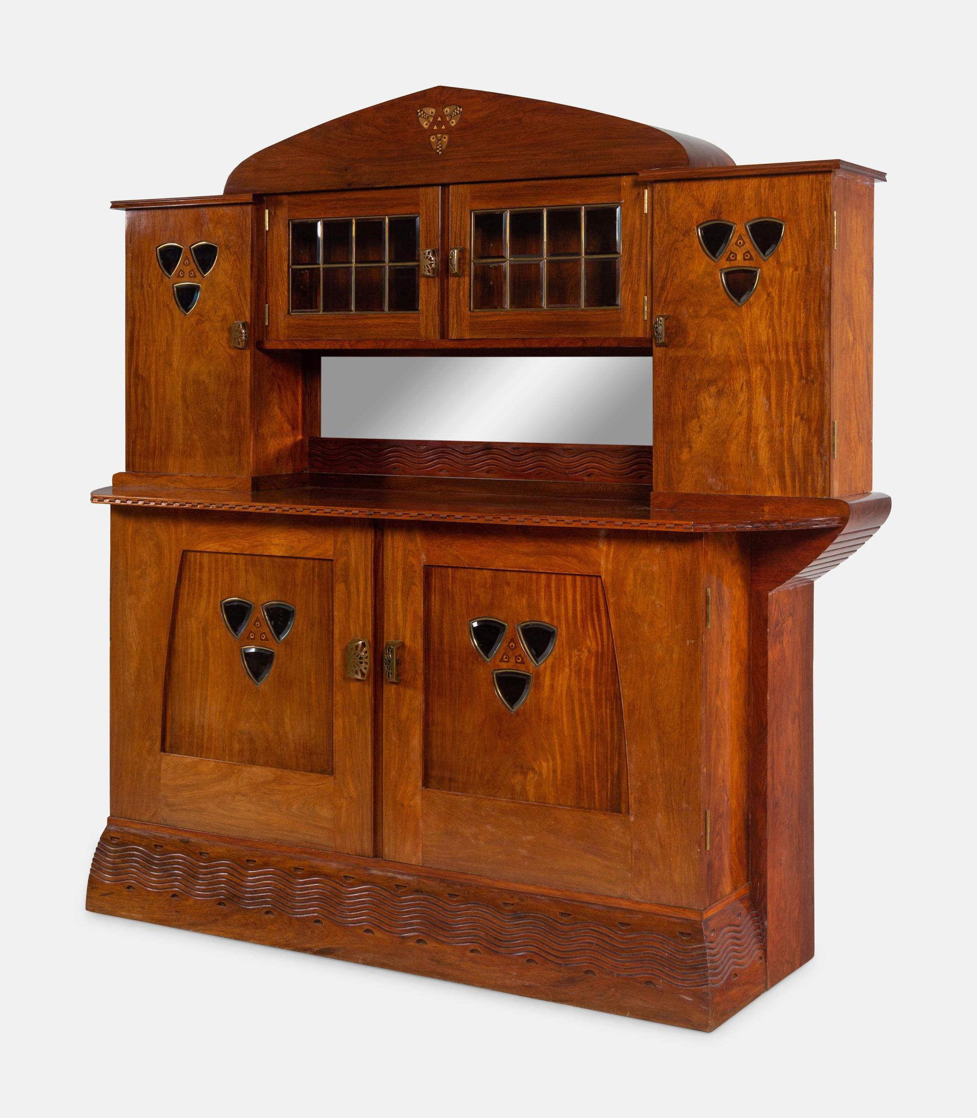 An Austrian Secessionist Inlaid Dining Suite, comprising a sideboard, a server, an extension dining table with five leaves, six side chairs and four armchairs