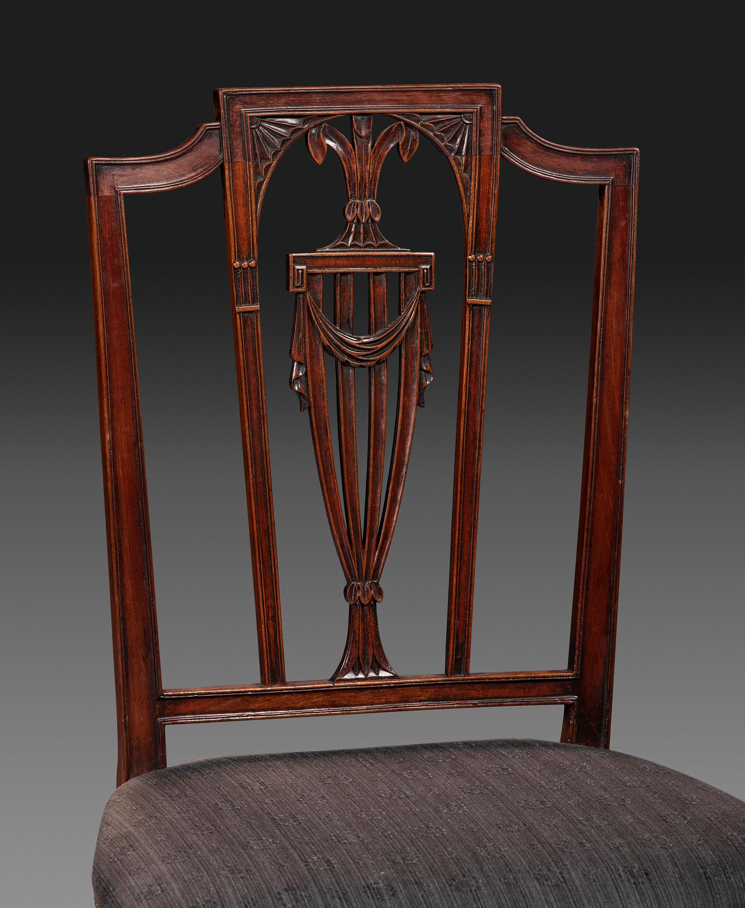 A Set of Eight Federal Carved Mahogany Dining Chairs