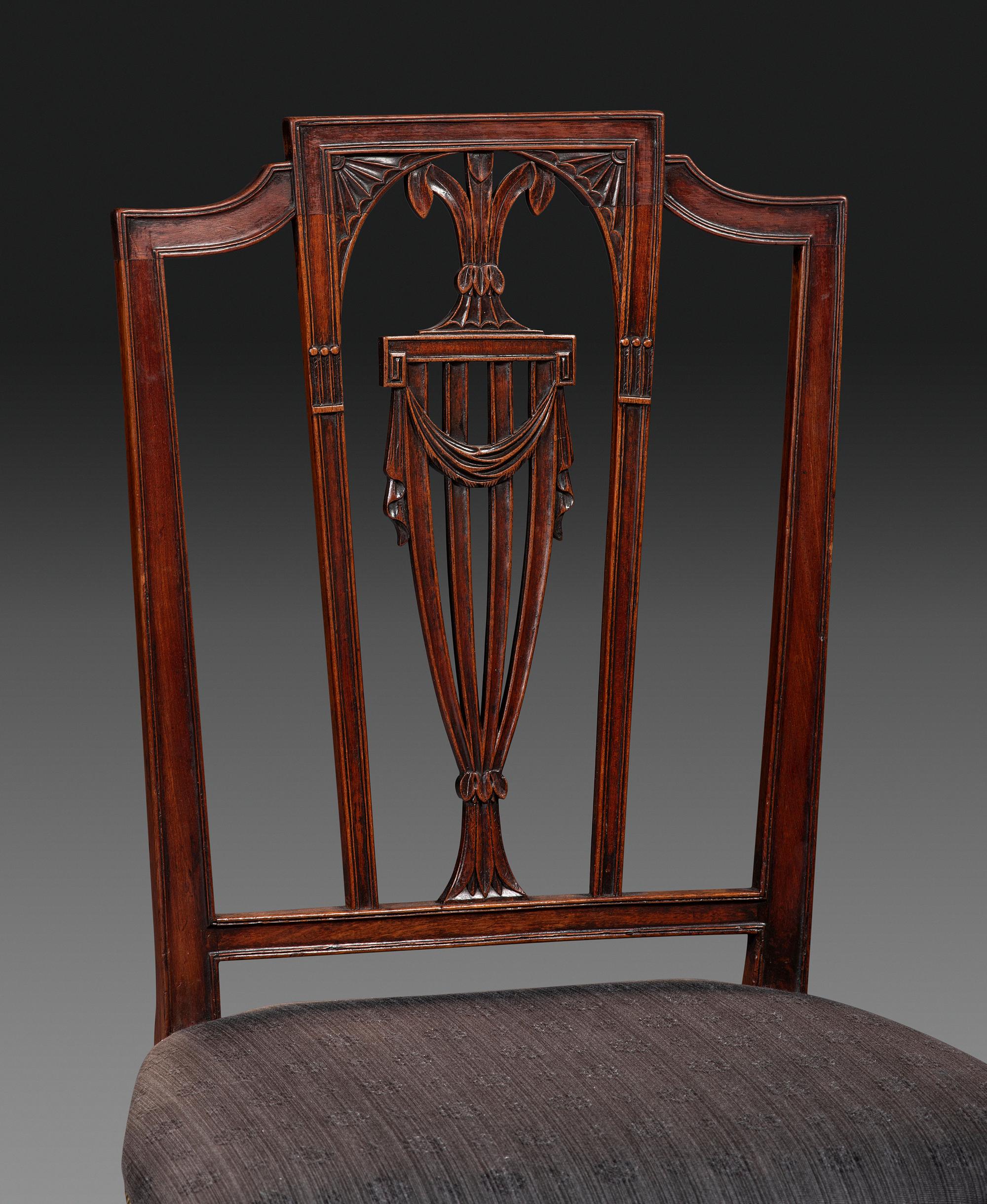 A Set of Eight Federal Carved Mahogany Dining Chairs