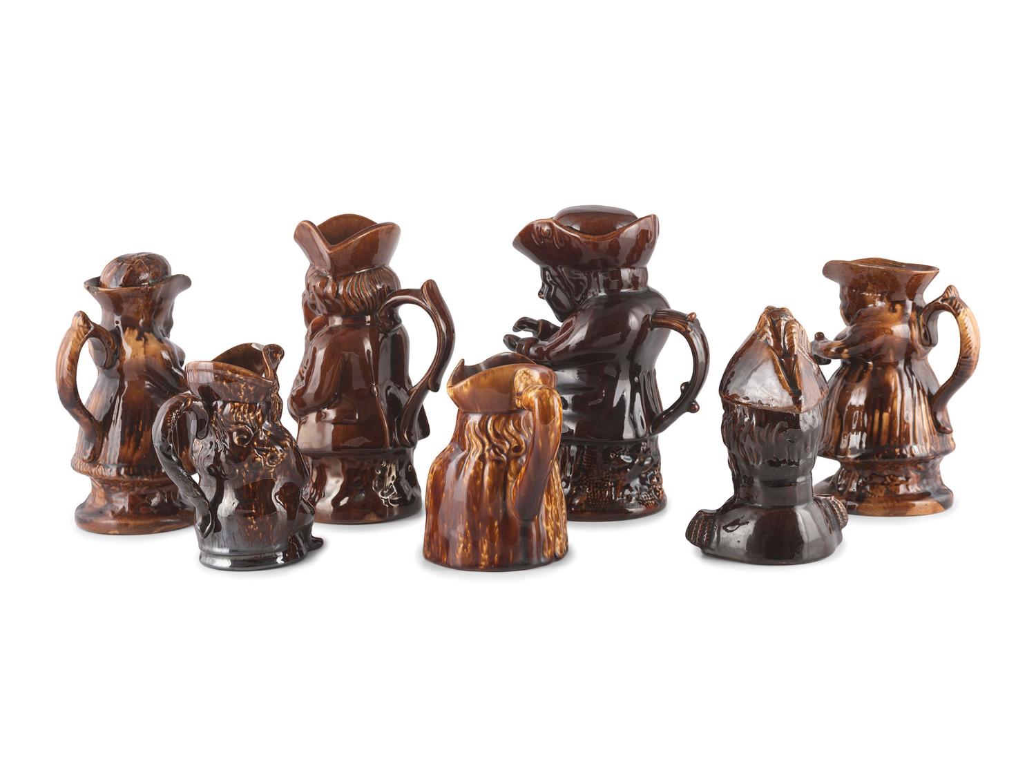 Seven Rockingham Glaze Toby Jugs