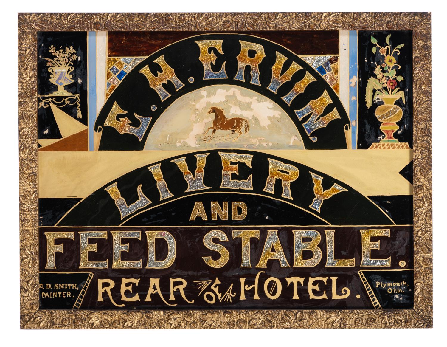 A Reverse Painted and Foil Decorated E. H. Ervin Livery and Feedstable Shop Sign