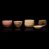 A Group of Four Assorted Japanese Chawan and a Sake Cup, Primarily 20th Century