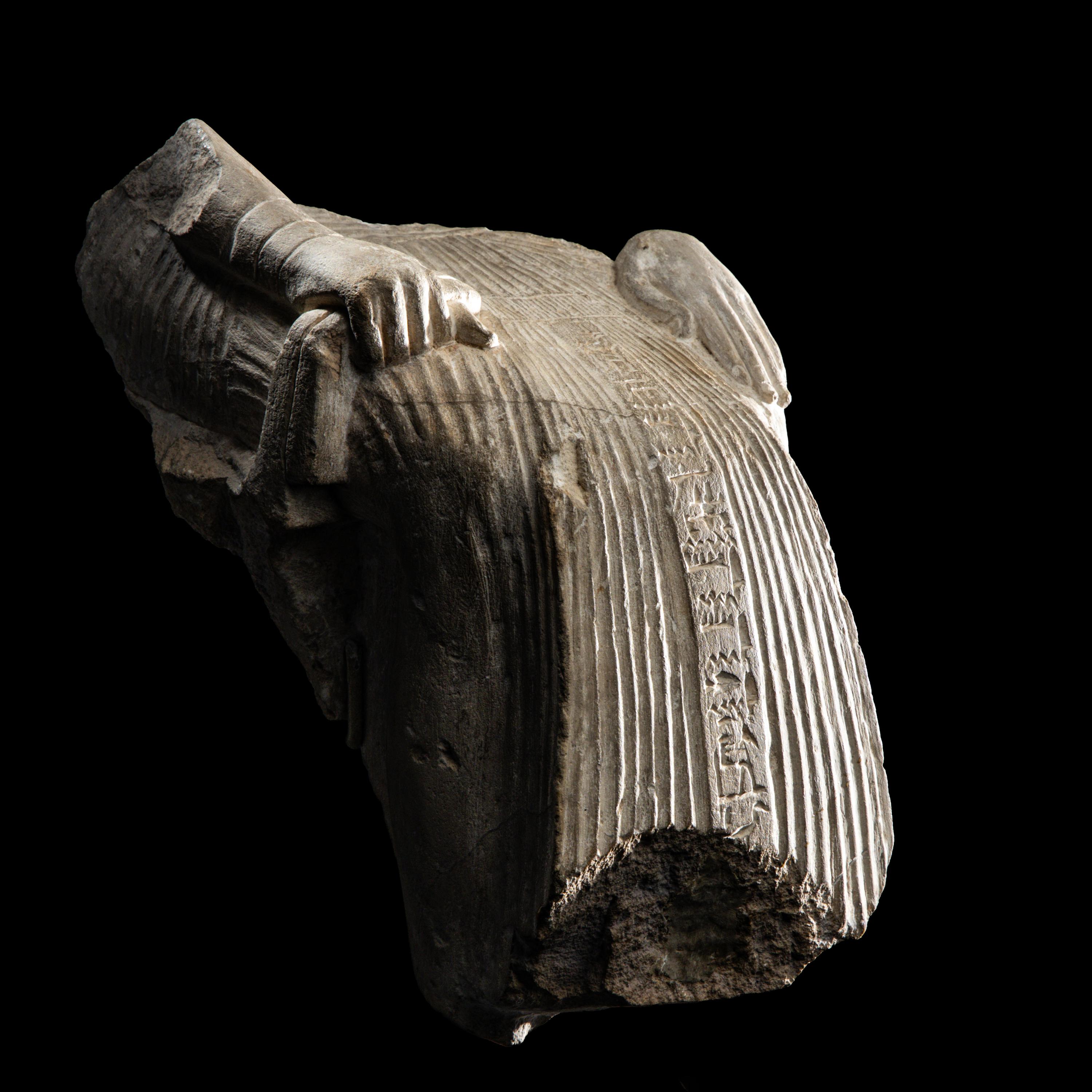 An Egyptian Limestone Fragment of a Seated Scribe
