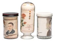 A Collection of John A. Adams Sand Art Bottles, Along with Custom Box and Unused Bottle