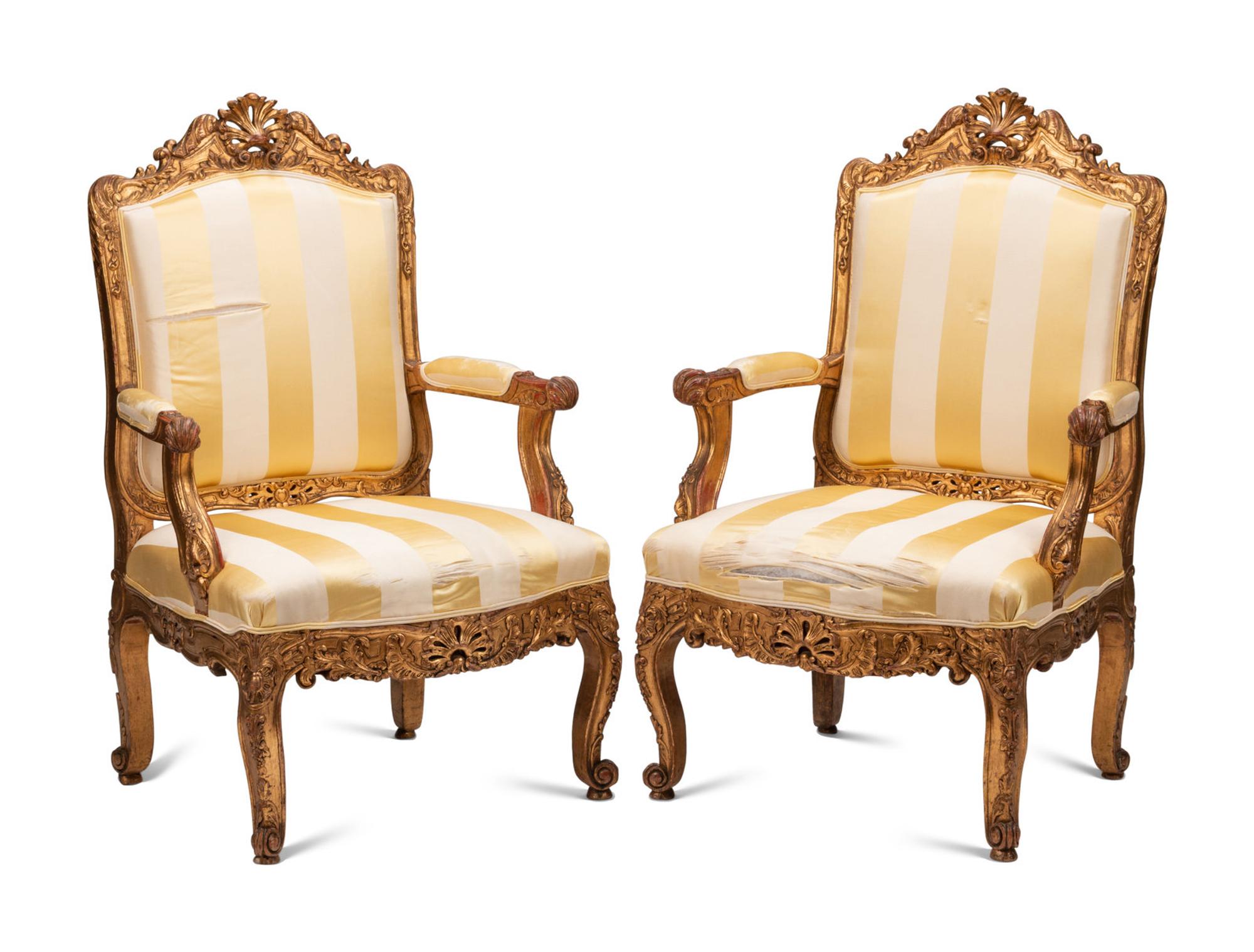 A Pair of Régence Style Giltwood Fauteuils