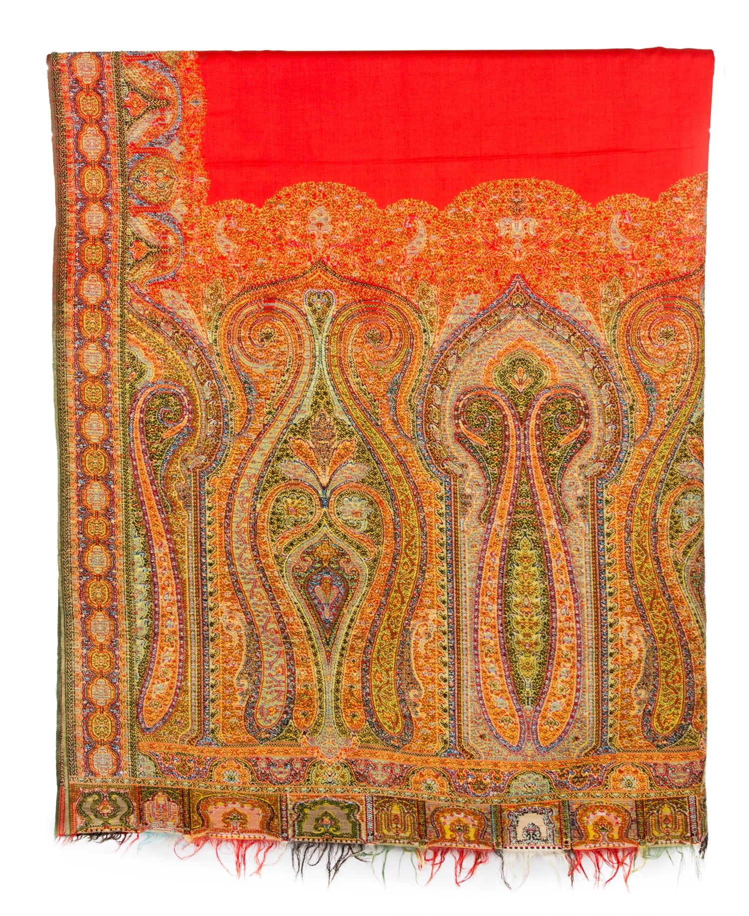 A Group of Pillows and Two Paisley Coverlets Larger paisley 10 feet 11 inches x 5 feet 4 inches.