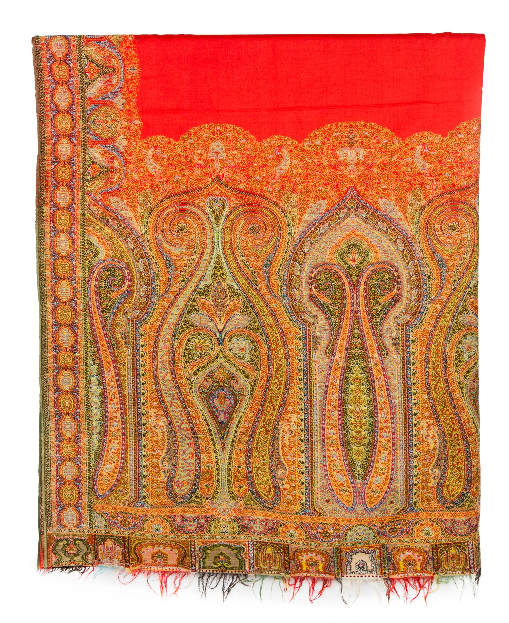 A Group of Pillows and Two Paisley Coverlets Larger paisley 10 feet 11 inches x 5 feet 4 inches.