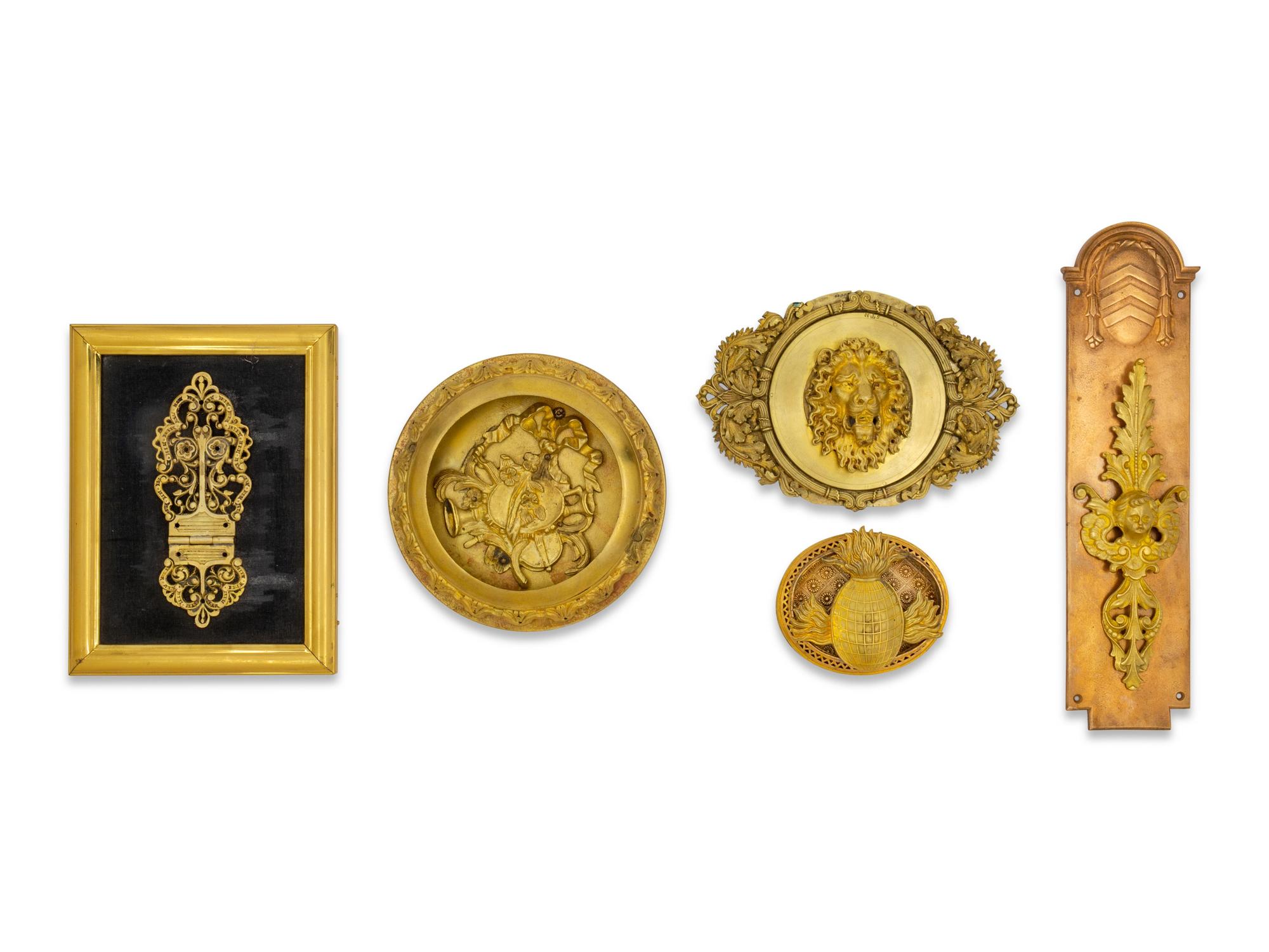 Five Gilt Bronze and Gilt Metal Plaques