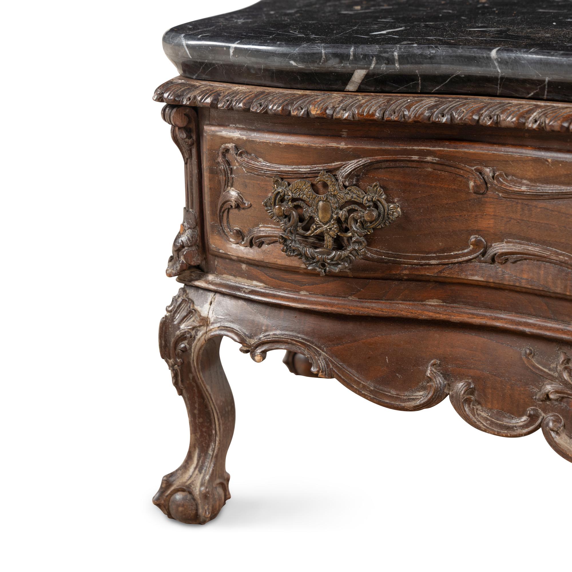 An Italian Carved Walnut and Marble Top Low Console