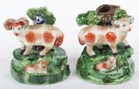 A Pair of Ceramic Figures of Sheep on Bocage Base Height 6 inches.