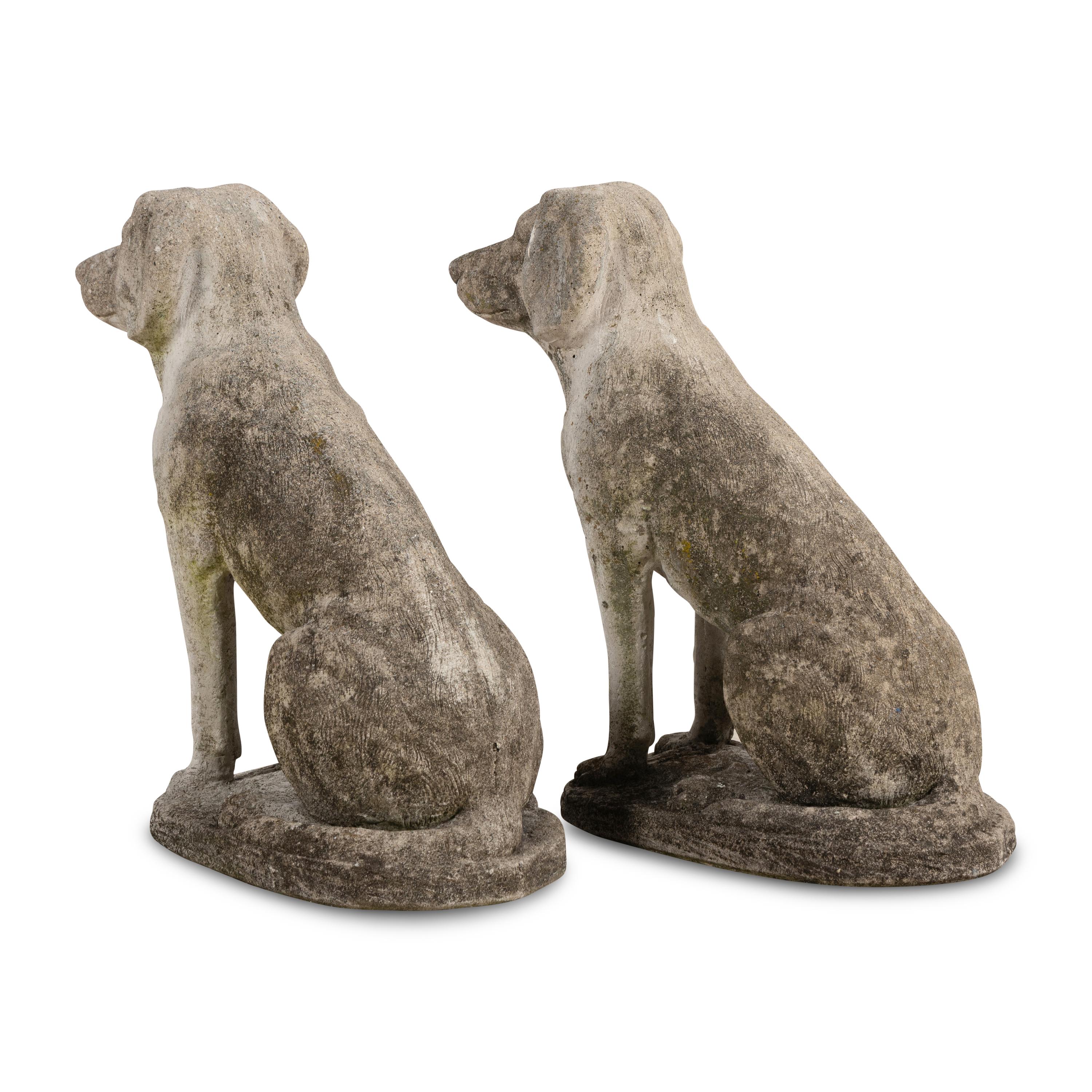 A Pair of Cast Stone Figures of Dogs