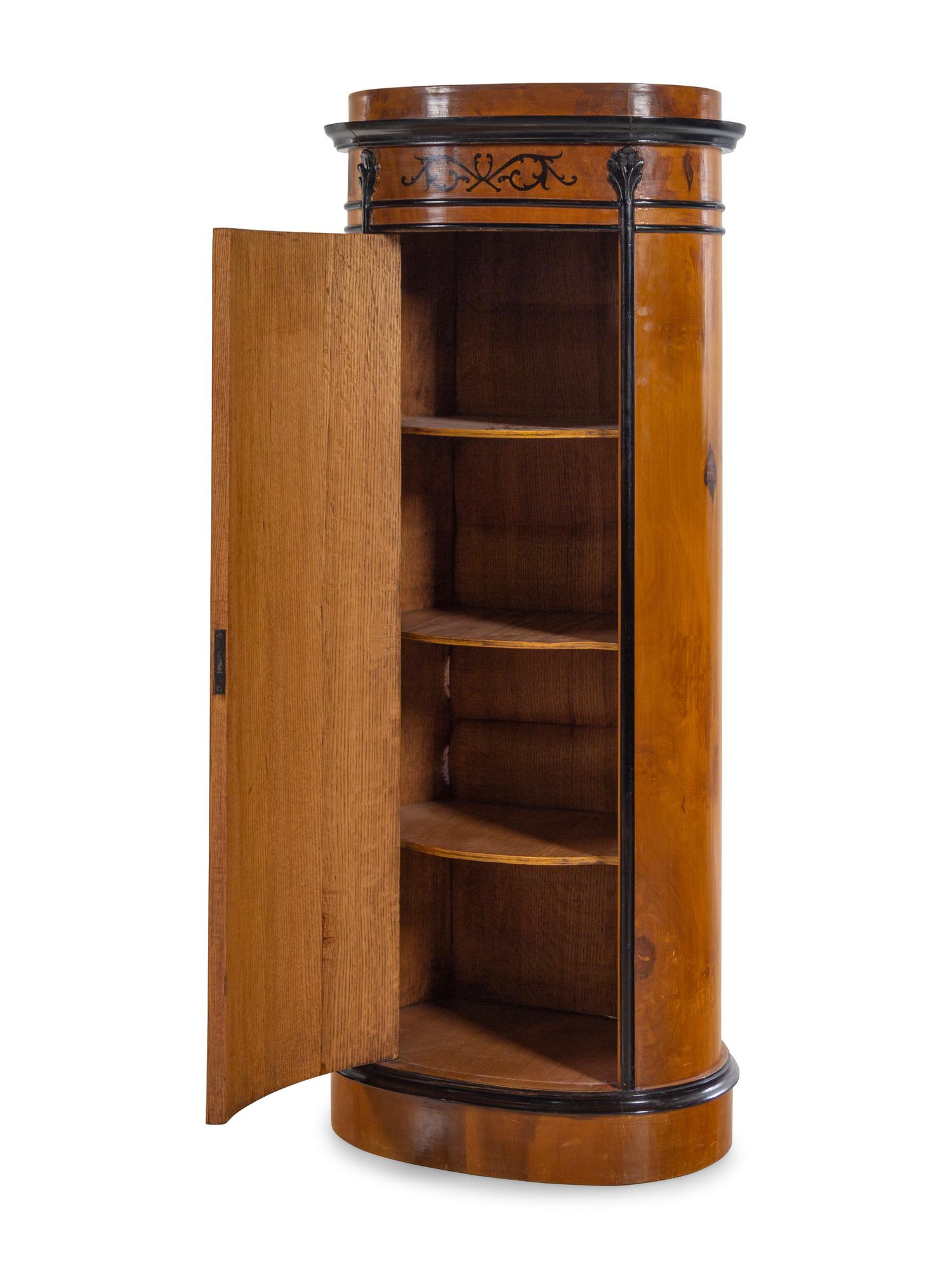 A Pair of Biedermeier Style Parcel Ebonized Satinwood Pedestal-Form Cabinets