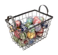 A Collection of English Polychrome Glazed Carpet Balls in a Wirework Basket
